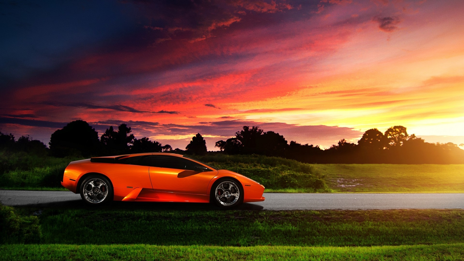 Orange Lamborghini Murcielago in the purple sunset