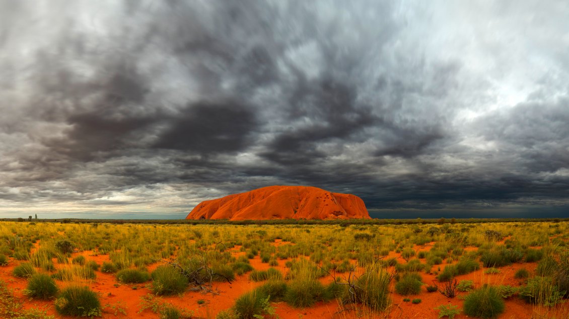 Download Wallpaper Ayers Rock and sky with clouds in Australia