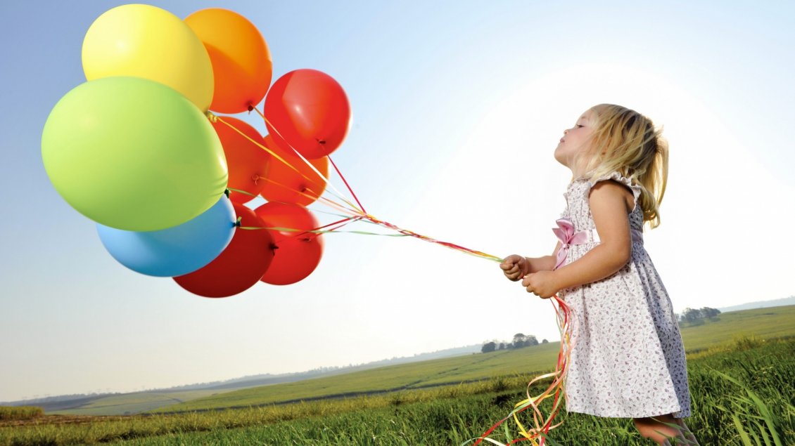 Download Wallpaper The girl with many colorful balloons in the grass