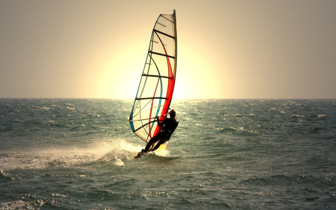 Download Wallpaper Windsurfing in the sunrise on the sea