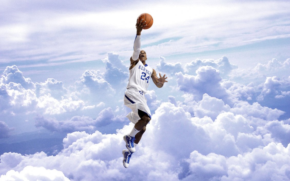 Download Wallpaper Basketball player with his ball in the air above the clouds