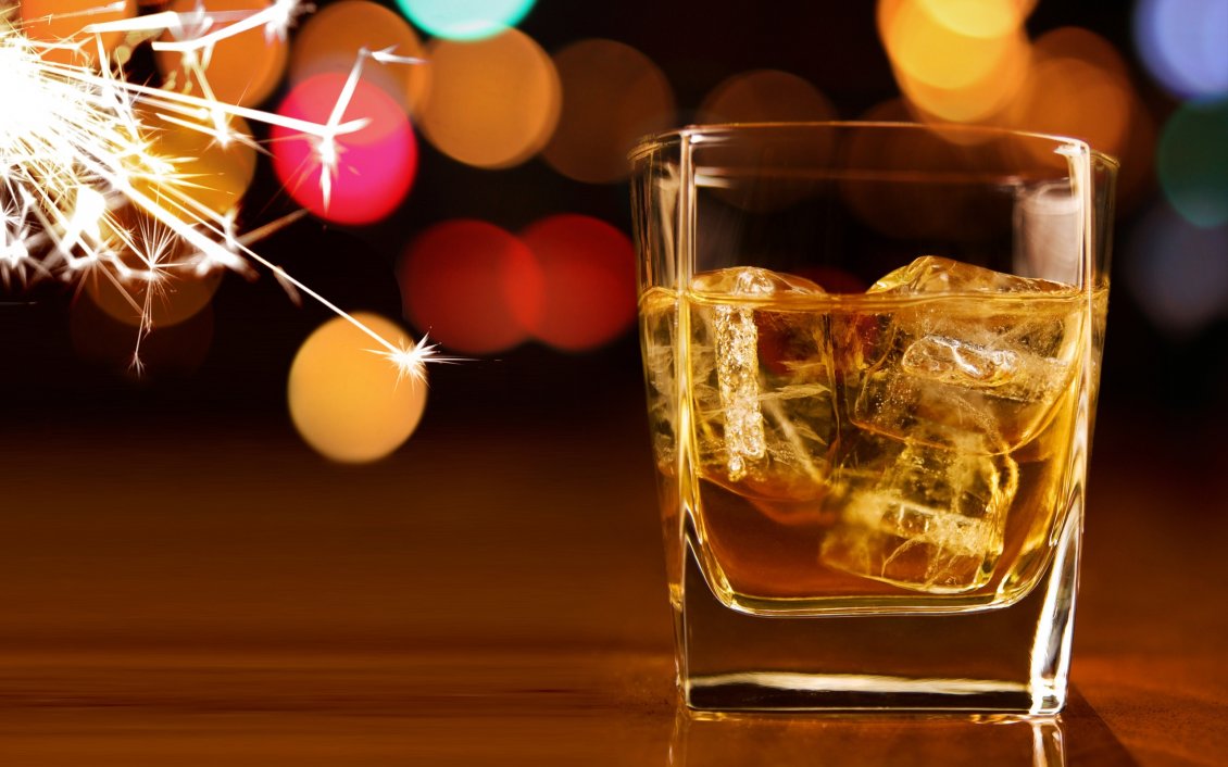 Download Wallpaper A glass of whisky with ice and fireworks in the night