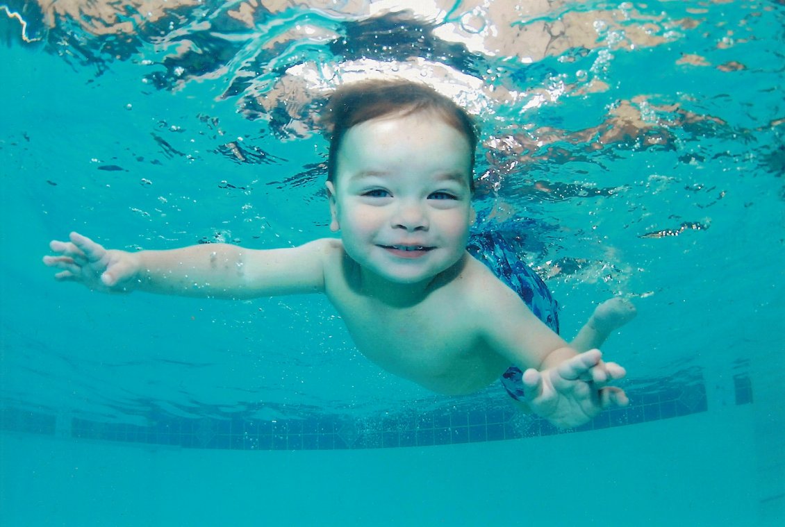 Download Wallpaper A cute baby swimming under water