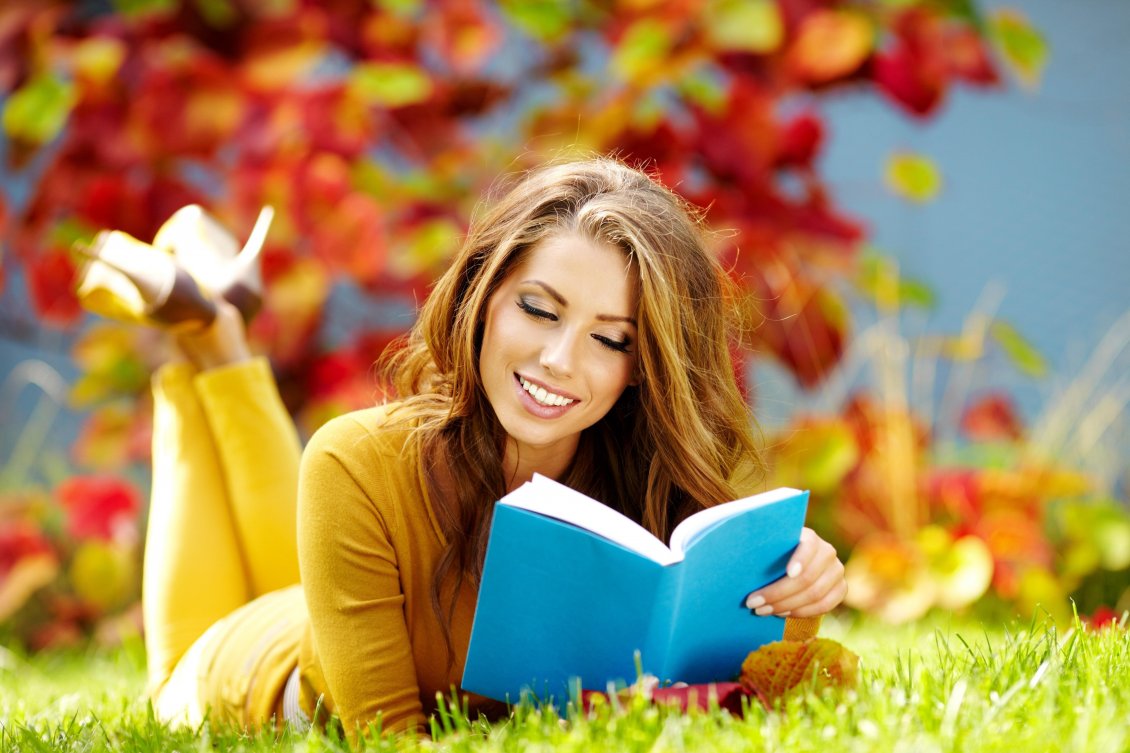 Download Wallpaper Girl in yellow reading a book on the grass in garden
