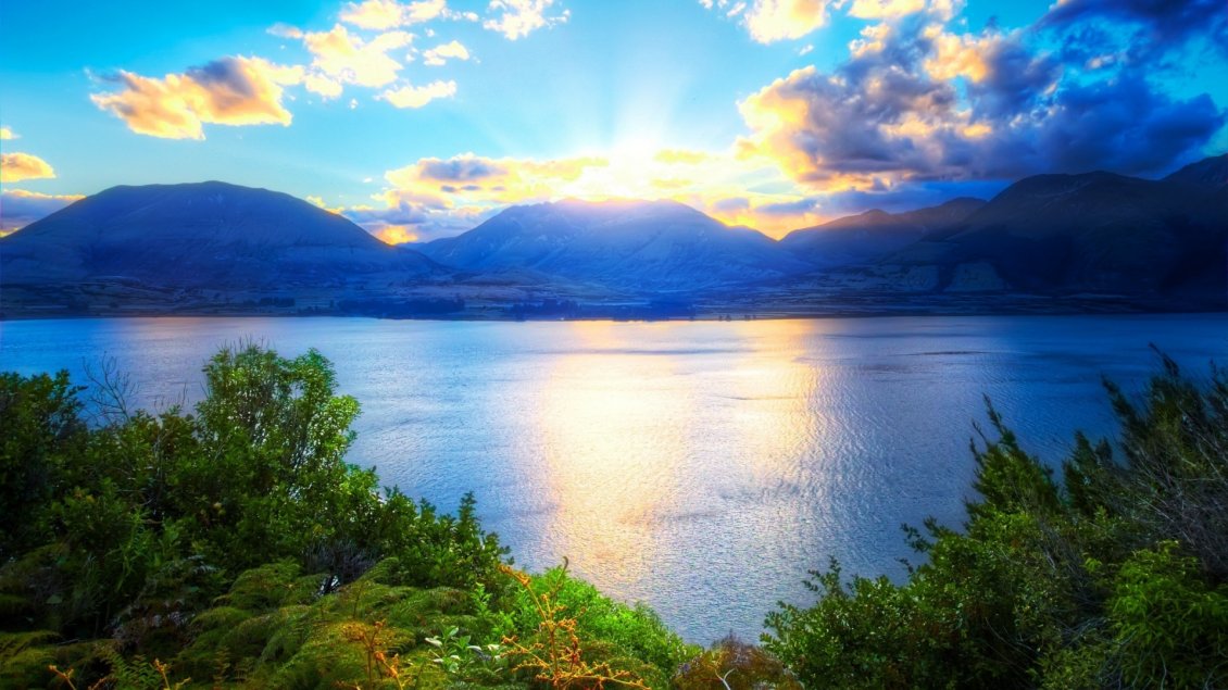 Download Wallpaper Relaxing landscape with water, mountains and sunlight