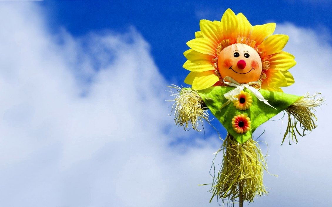 Download Wallpaper Scarecrow made of flower and straw in the sky