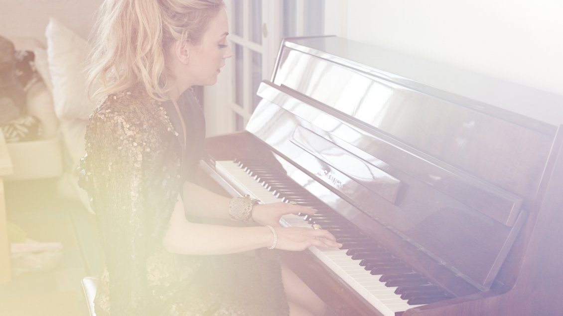 Download Wallpaper Emily Kinney, an American actress, playing the piano