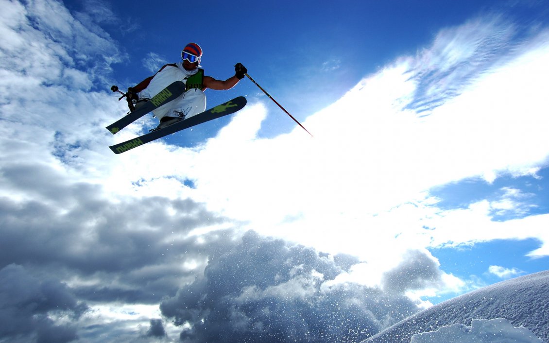 Download Wallpaper Skiing jumps on a beautiful sunny winter day