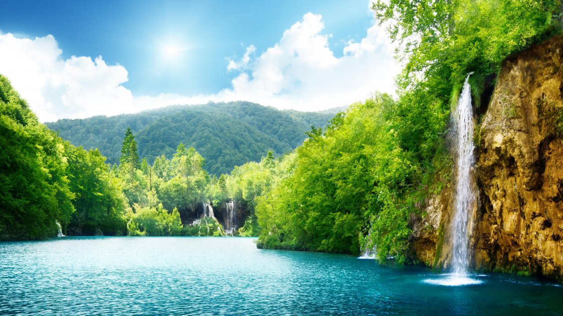 Download Wallpaper Summer sunny day and wonderful waterfall in the nature