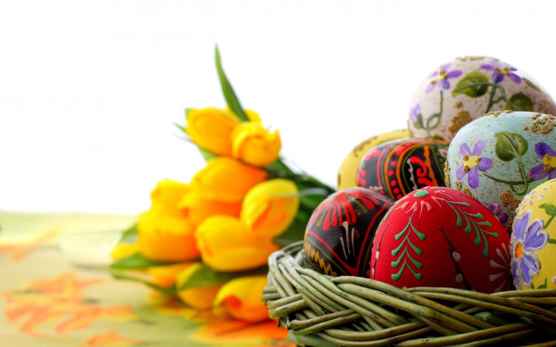Download Wallpaper Colorful Easter eggs and yellow tulips on background