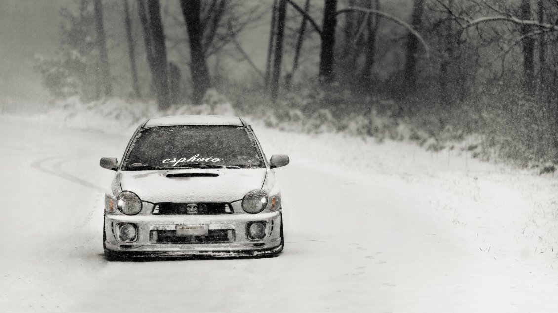 Download Wallpaper White race car on the road in the winter season