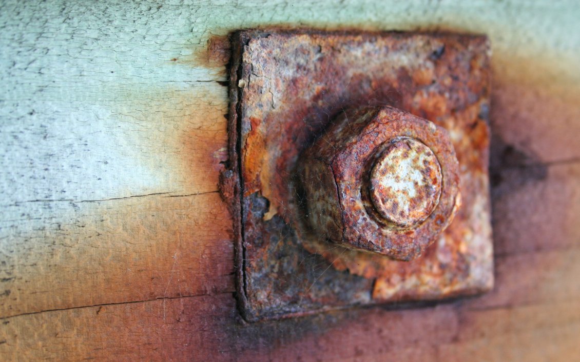 Download Wallpaper Old and rusty piece of iron - screw in wood HD wallpaper