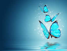 Three blue and magic butterflies