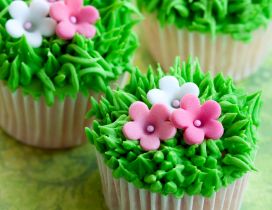 Muffins with grass and flowers arrangement