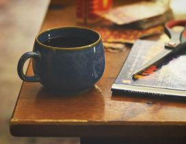 A cup of coffee and a book