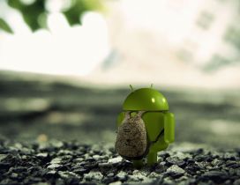 An android with a backpack on the stones