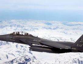Aircraft Fighter AK 11AF flying over the white mountains