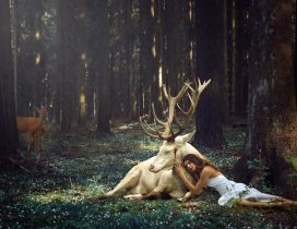 A girl beside a white deer in the forest