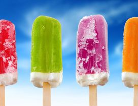Four ice creams in different colors for a hot day
