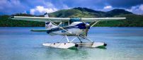 A white seaplanes was landed on water