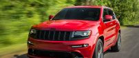 Red Jeep Grand Cherokee SRT8 on road