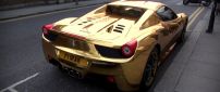 Gold Ferrari 458 Spider in a parking