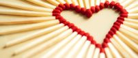 A red heart made of many matches