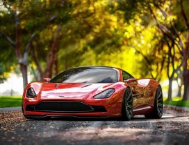 Red Aston Martin DBC Superb in a park