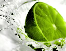 Green lime in the water - delicious fresh drink