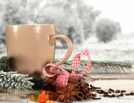 Cream colored coffee cup and cinnamon - Christmas moments