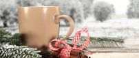 Cream colored coffee cup and cinnamon - Christmas moments