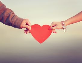 Love between two people - Red Heart give on Valentines Day