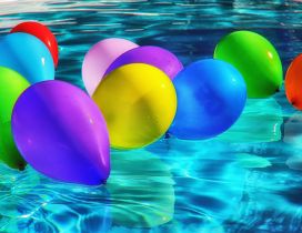 Party all day - Colorful balloons in the pool