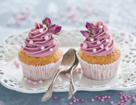 Two delicious muffins with pink cream - Flower for love