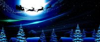 Santa Claus is in the air with reindeers - Christmas night