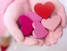 Painted wooden hearts on my hand - Love  red pink colors