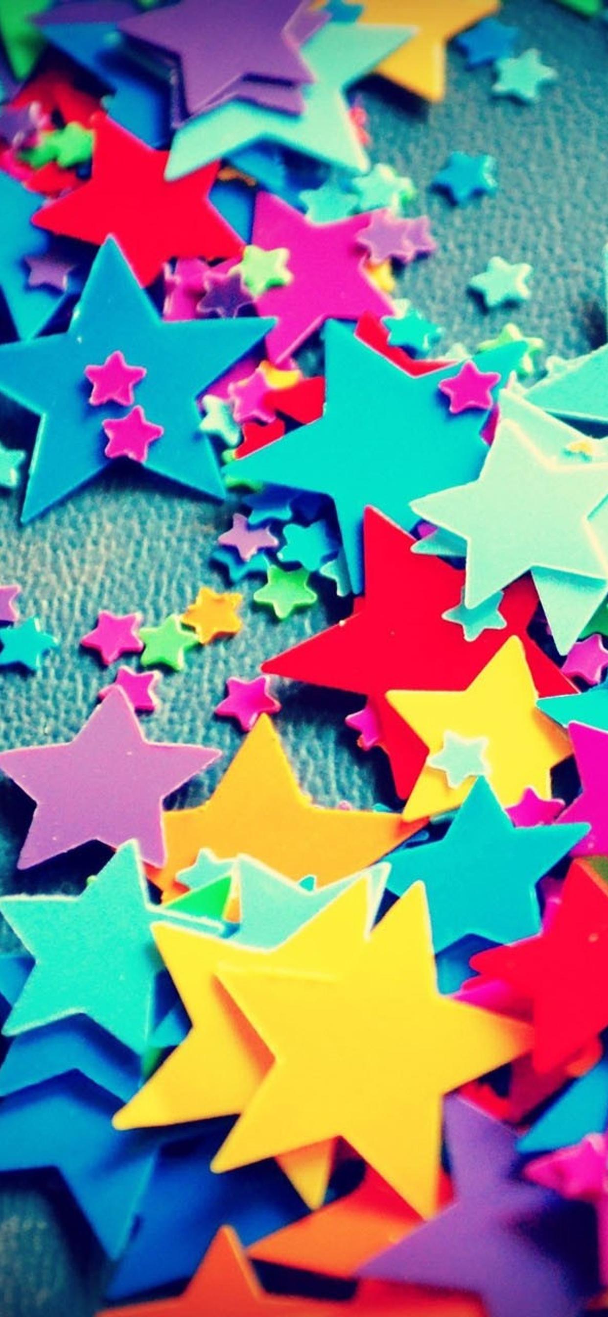 Paper colorful little stars on the wall - HD wallpaper