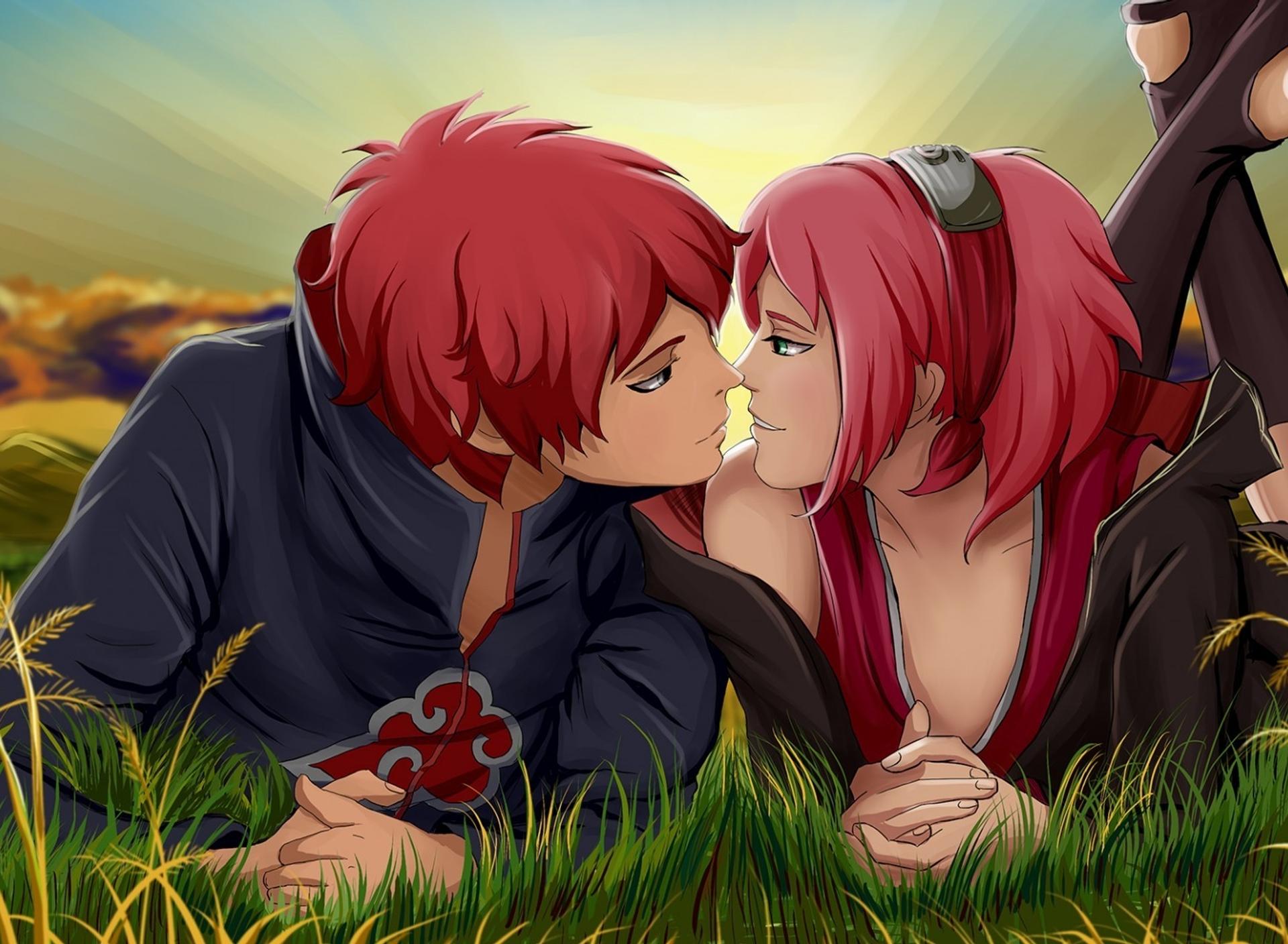 An anime couple with red hair kissing in the grass