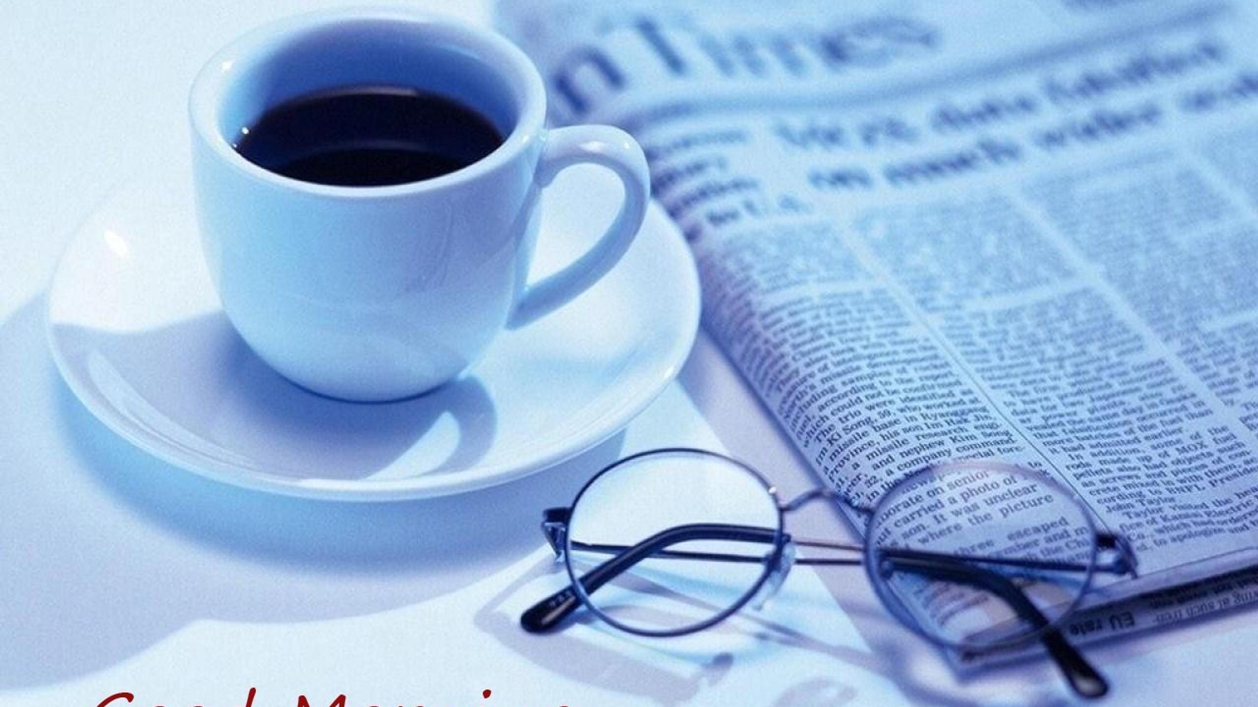 Good morning with a dark coffee and newspaper