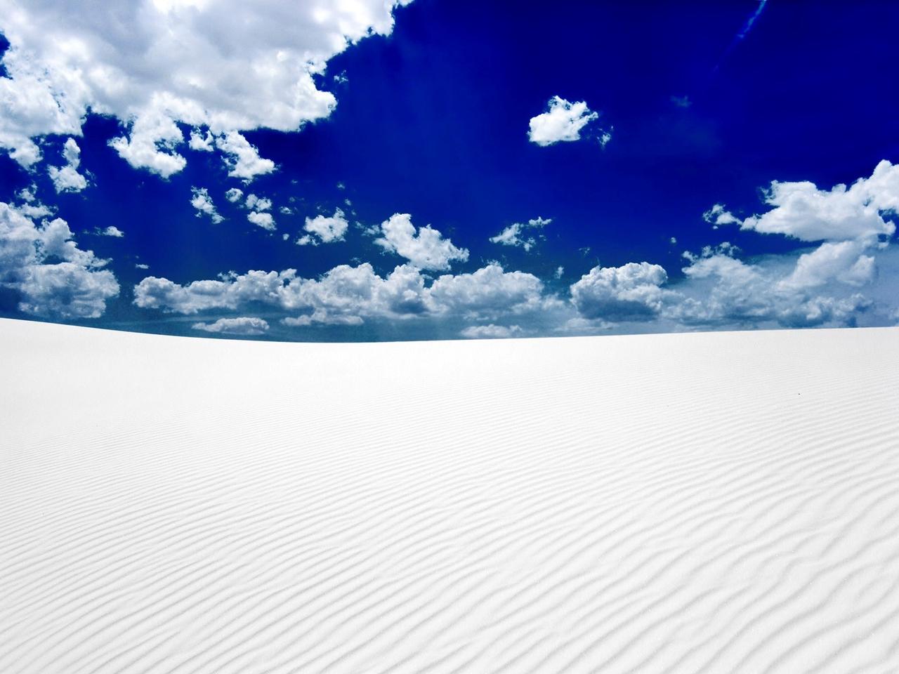 White sand in desert and blue sky