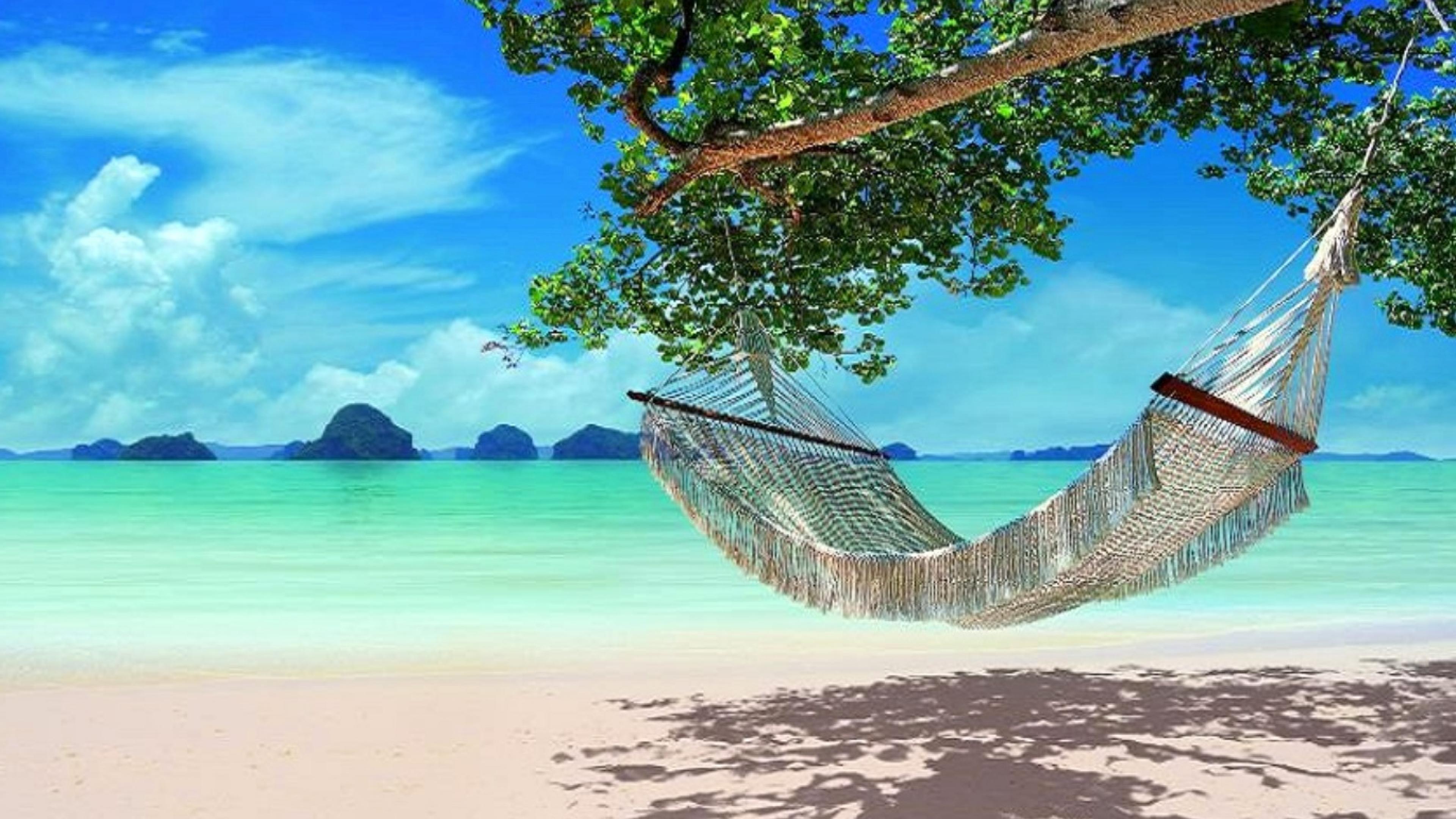 Relaxing hammock on the beautiful blue water