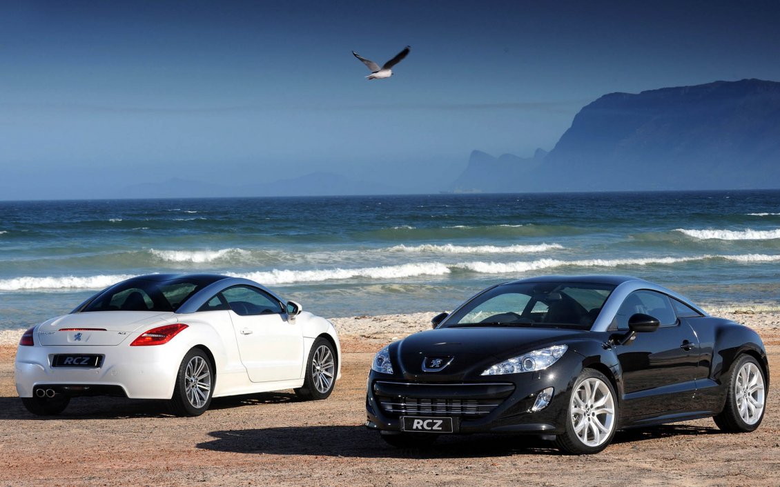 Download Wallpaper Two Peugeot RCZ on the beach