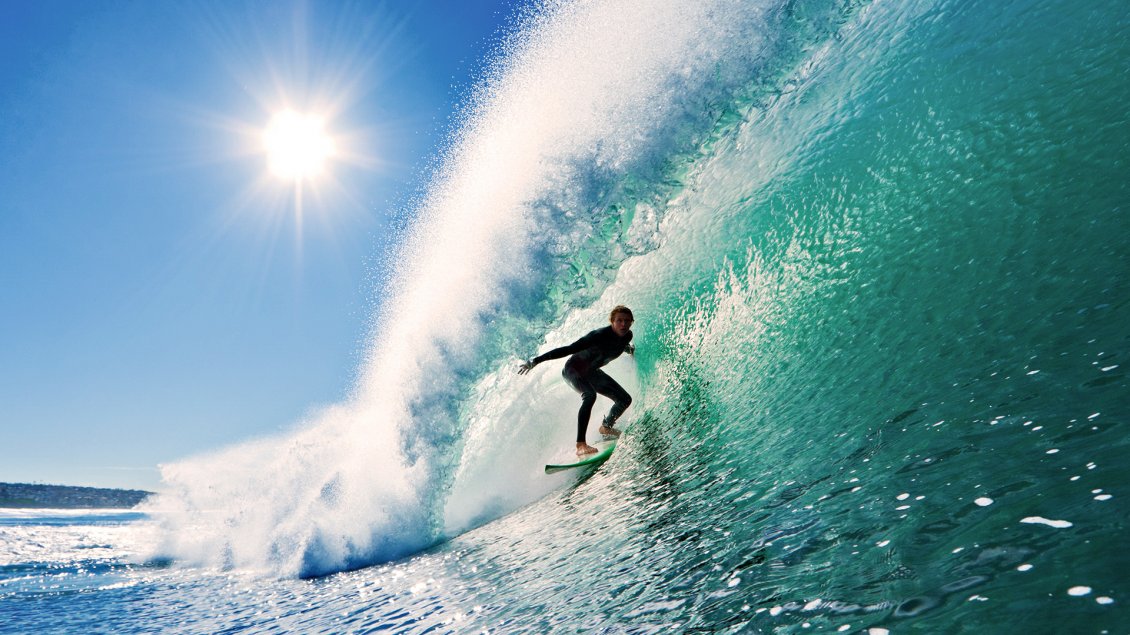 Download Wallpaper Surfing in the big waves in a sunny day