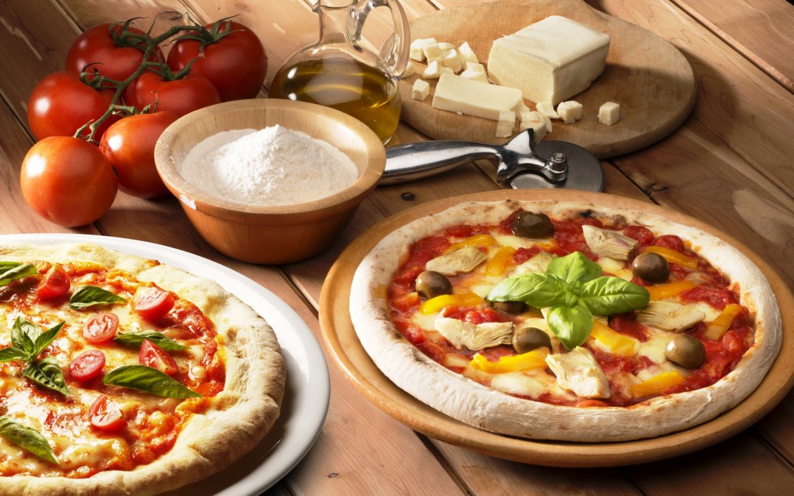 Download Wallpaper Two delicious pizzas on the table