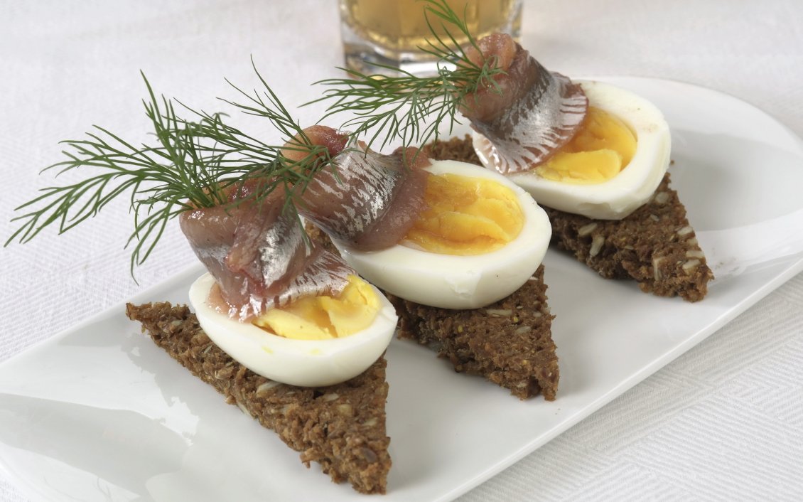 Download Wallpaper Three pieces of fish with boiled eggs on a plate