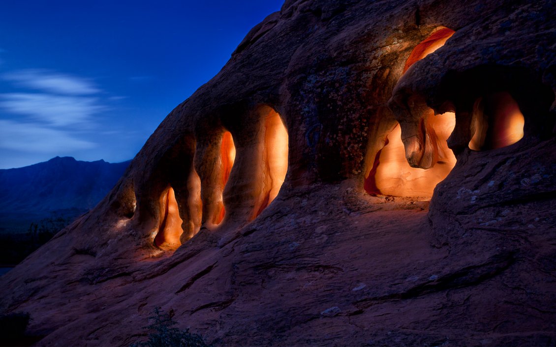 Download Wallpaper The caves in the rocks of the mountains