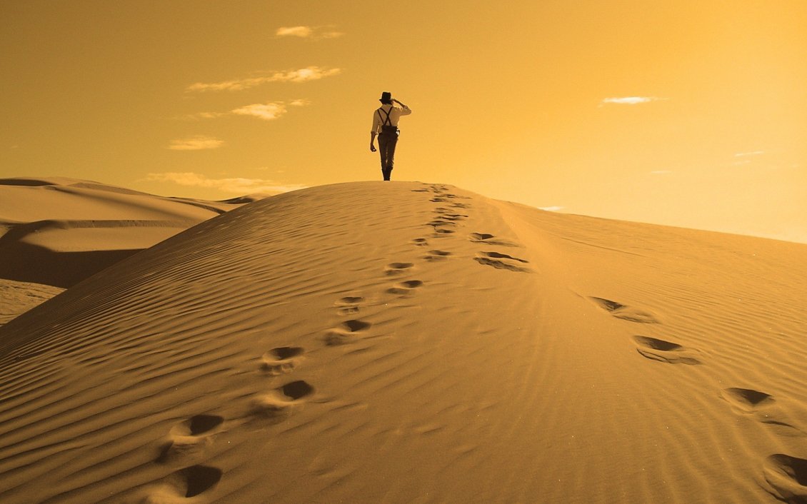 Download Wallpaper One man and his traces in the sand of desert