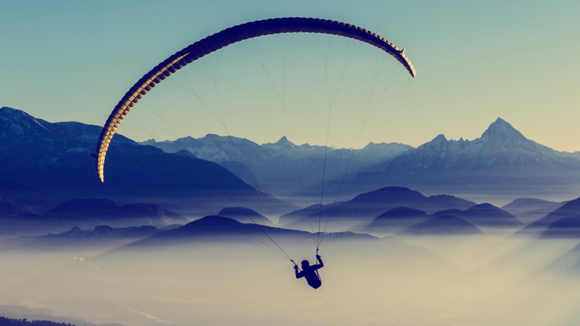 Download Wallpaper A man with paraglider over the mountains