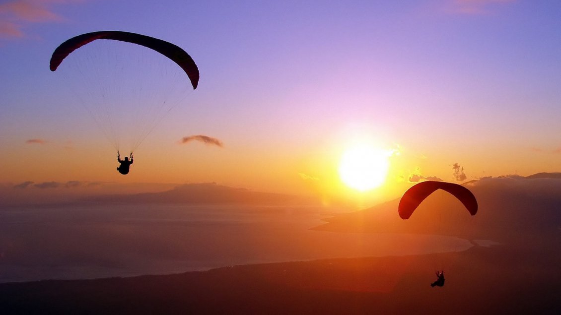 Download Wallpaper Two paratroopers flying in the sunset