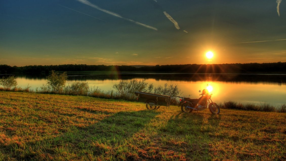 Download Wallpaper A motorcycle with trailer near the river in the sunset
